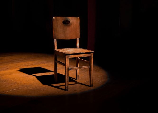 empty wooden chair on a stage