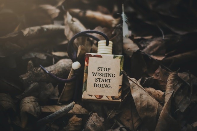 Locket in leaves that says stop wishing, start doing