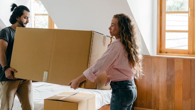 couple with moving boxes