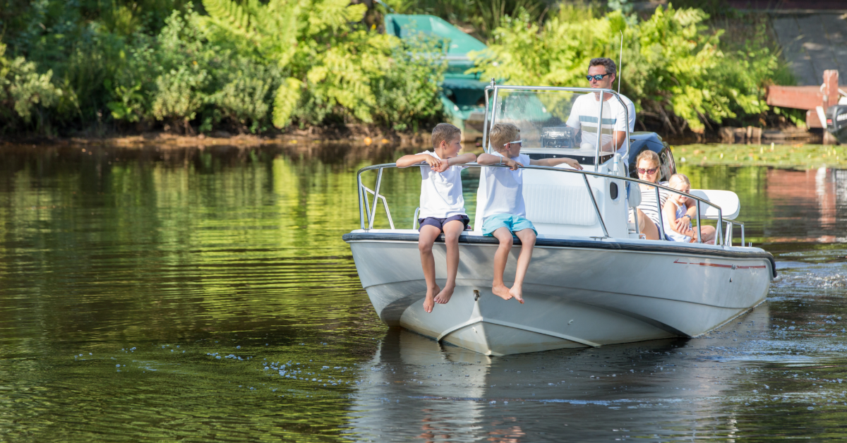 family on small boat