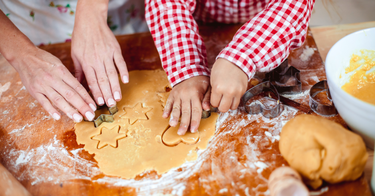adult and child making cookies